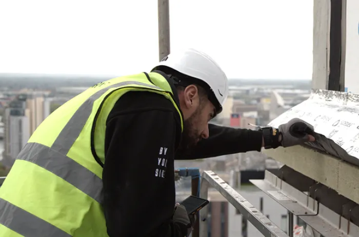 Siderise site services engineer verifying quality of passive fire protection install
