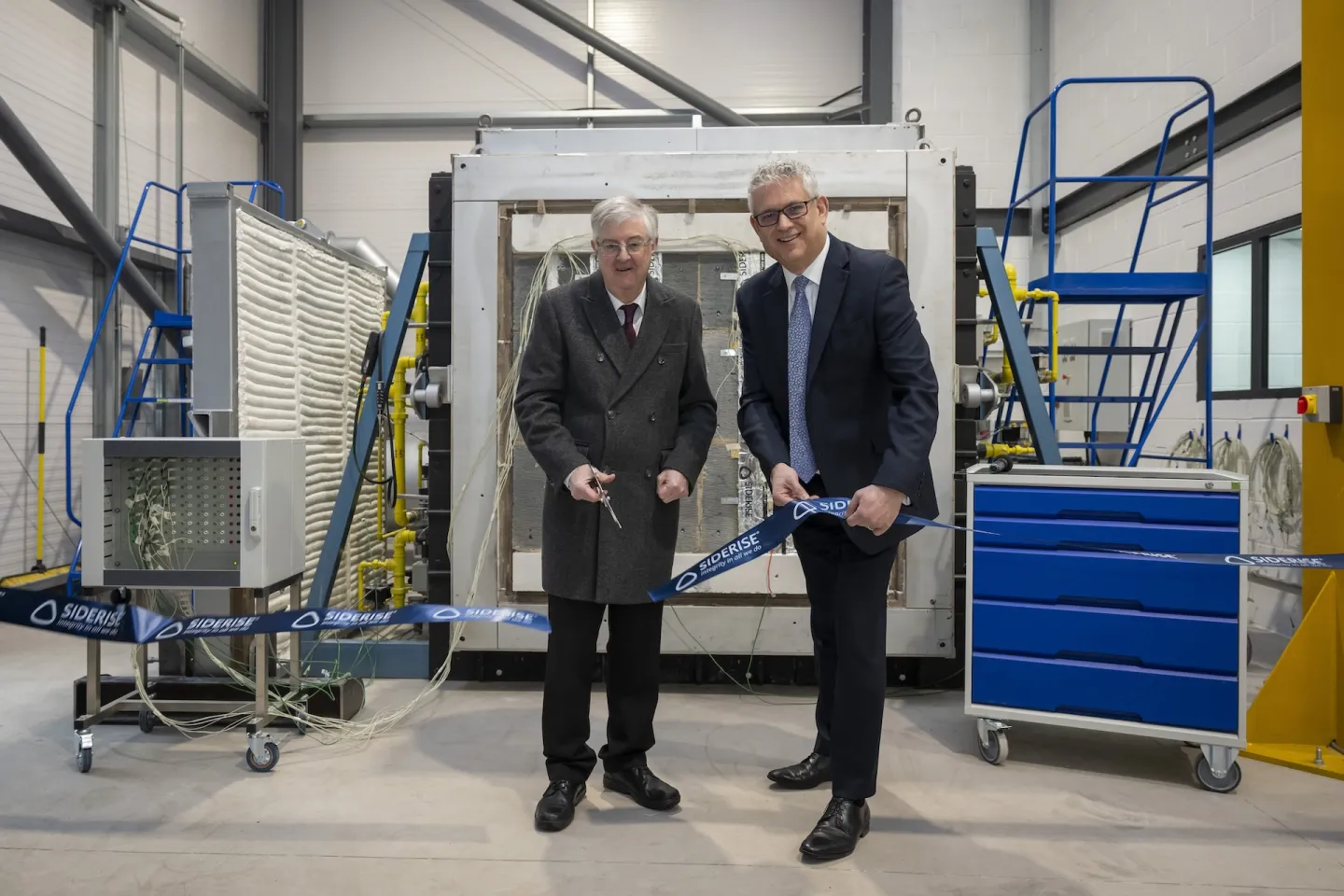 Mark Drakeford and Adam Turk Cutting a Ribbon